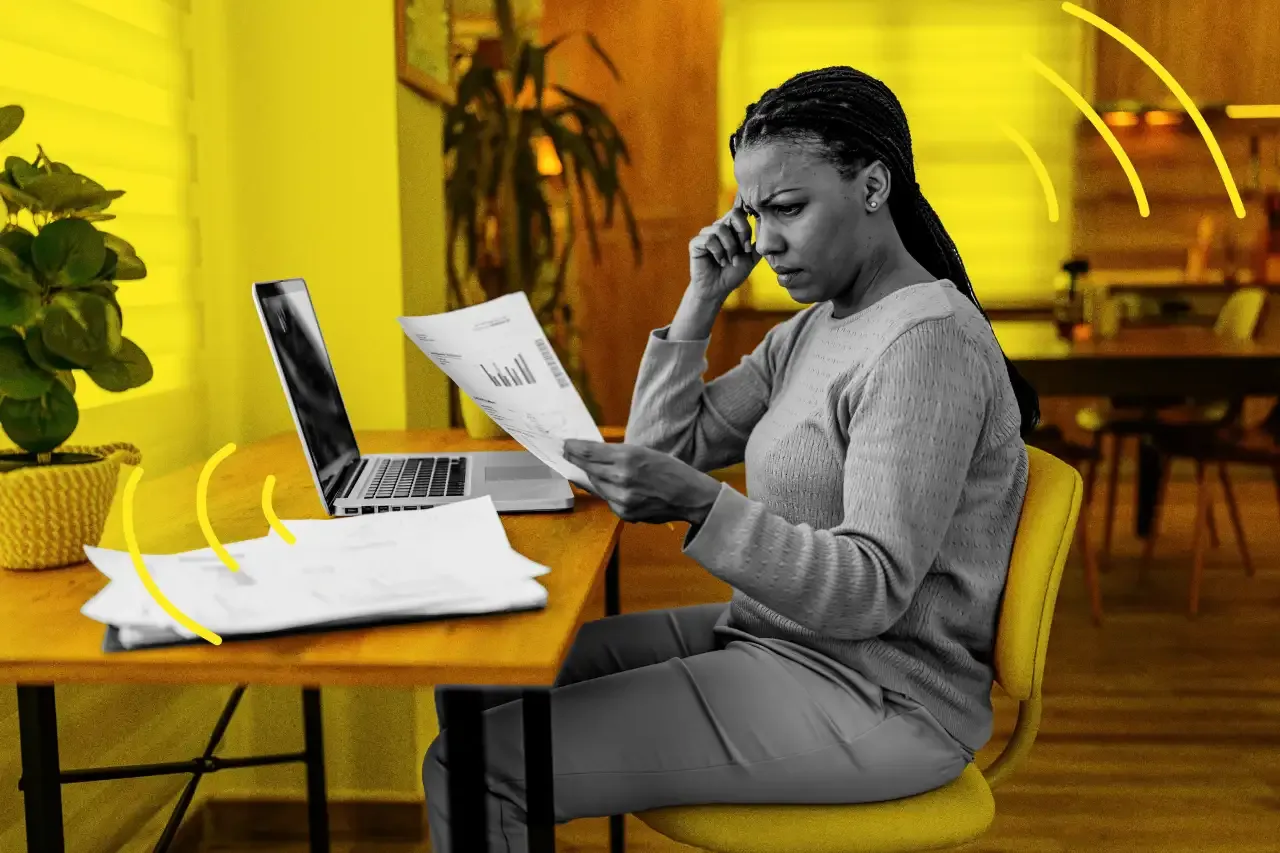 Stressed business owner reviewing MCA documents